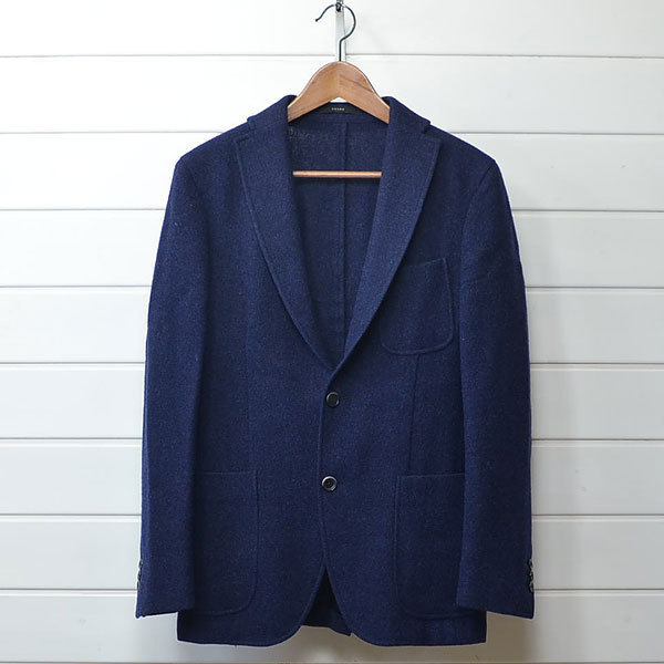 a blue jacket on a swinger